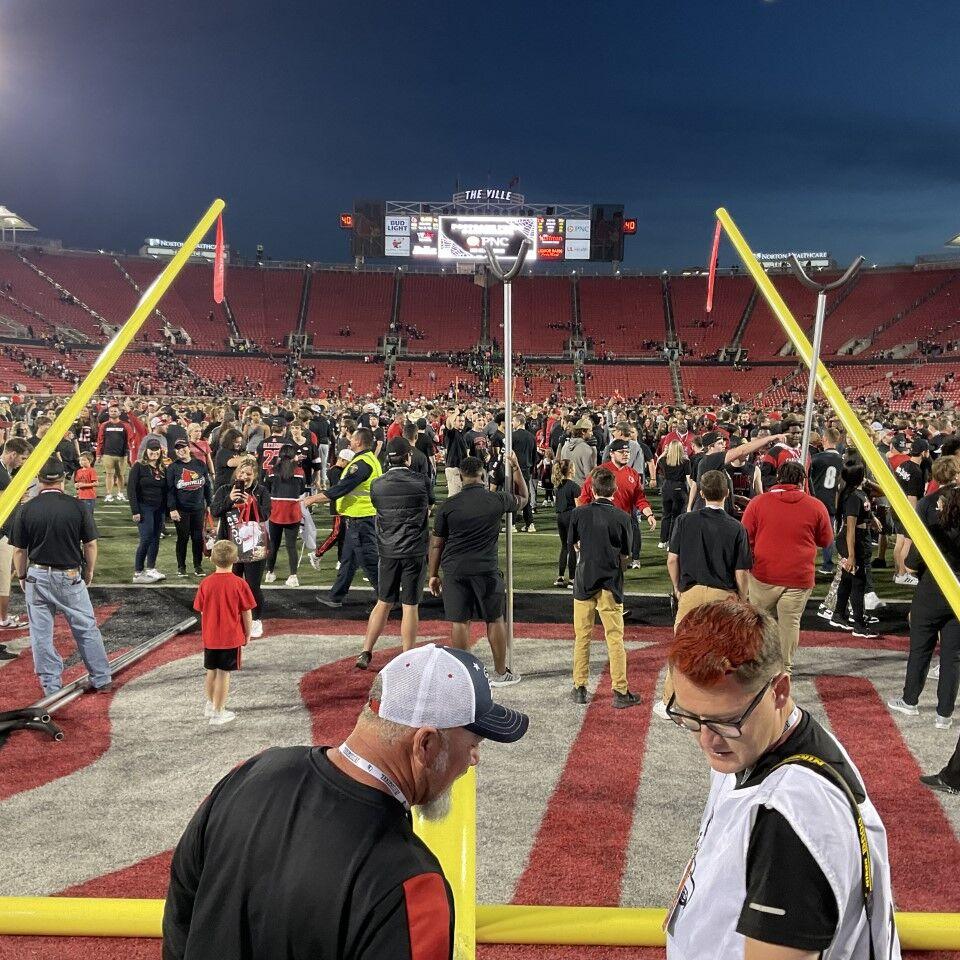 Fans storm the field at Cardinal Stadium